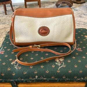 Dooney &Bourke cream and brown all weather pebbled leather 7 x 11 x 4 Crossbody